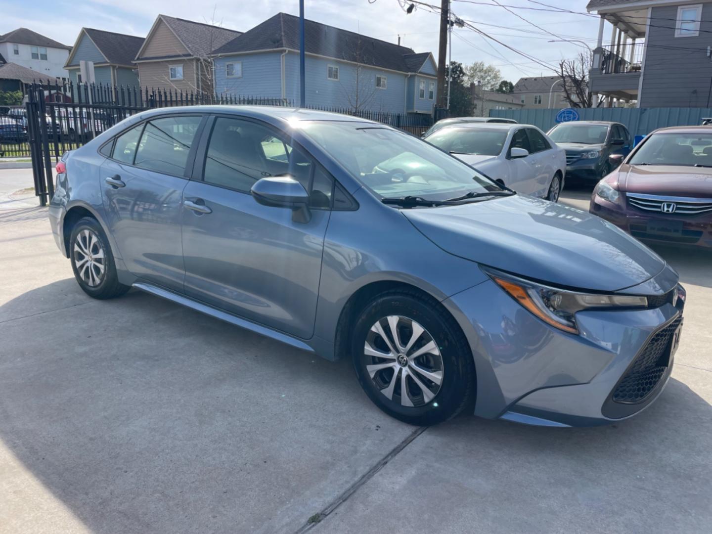 2022 Blue /Silver Toyota Corolla LE (JTDEAMDEXNJ) with an 1.8L Hybrid engine, Automatic transmission, located at 1501 West 15th St., Houston, 77008, (713) 869-2925, 29.797941, -95.411789 - Photo#1